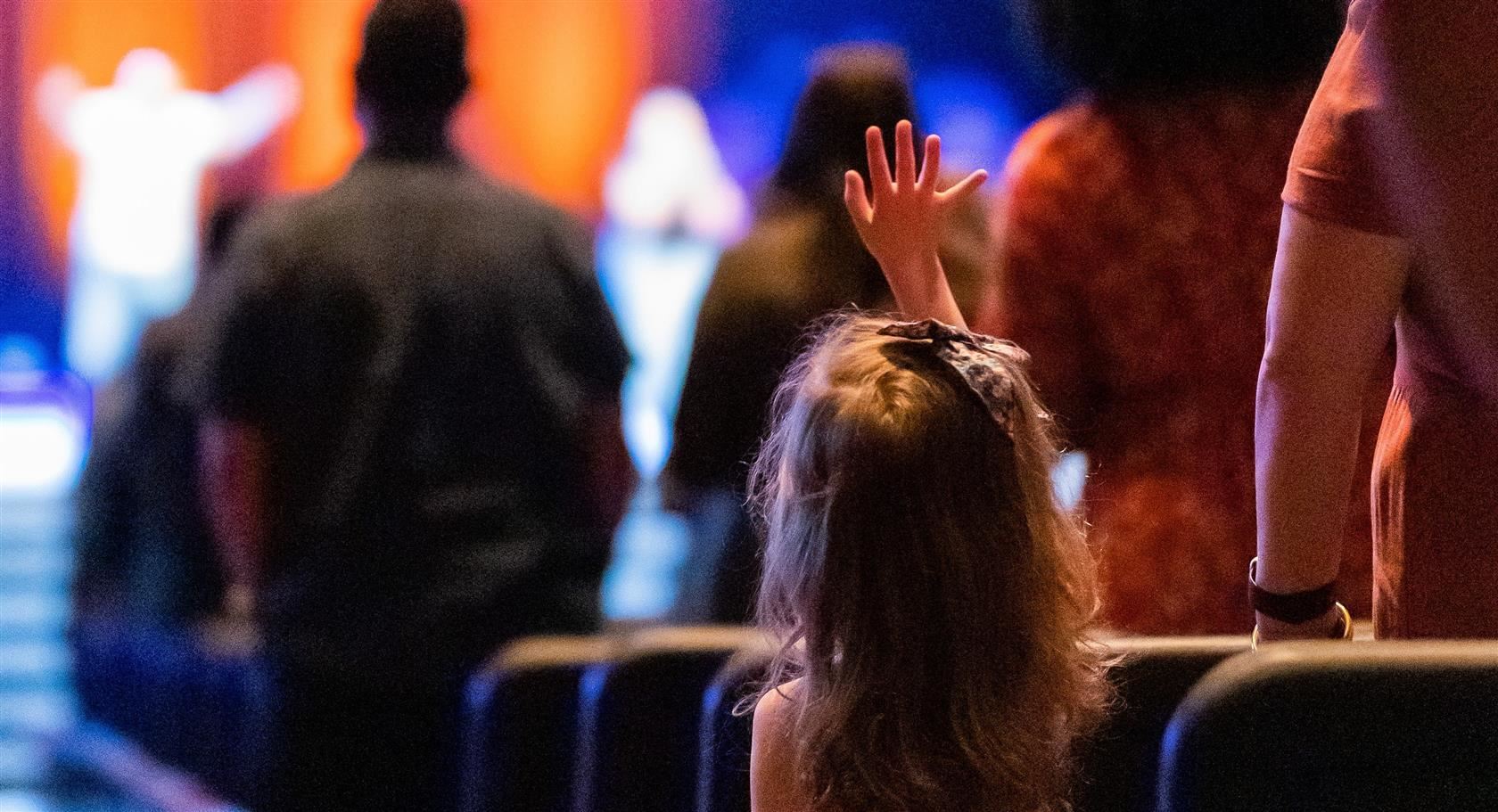  Student watching school play on stage