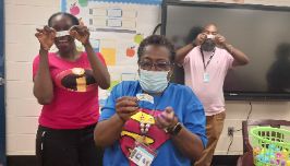  3 staff members opening Egg gifts