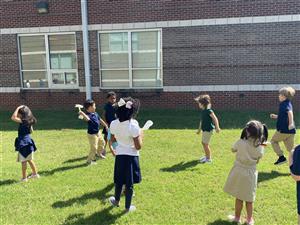 Students testing their makerspace creations outside