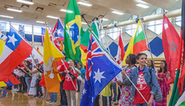  People standing in front of international flags