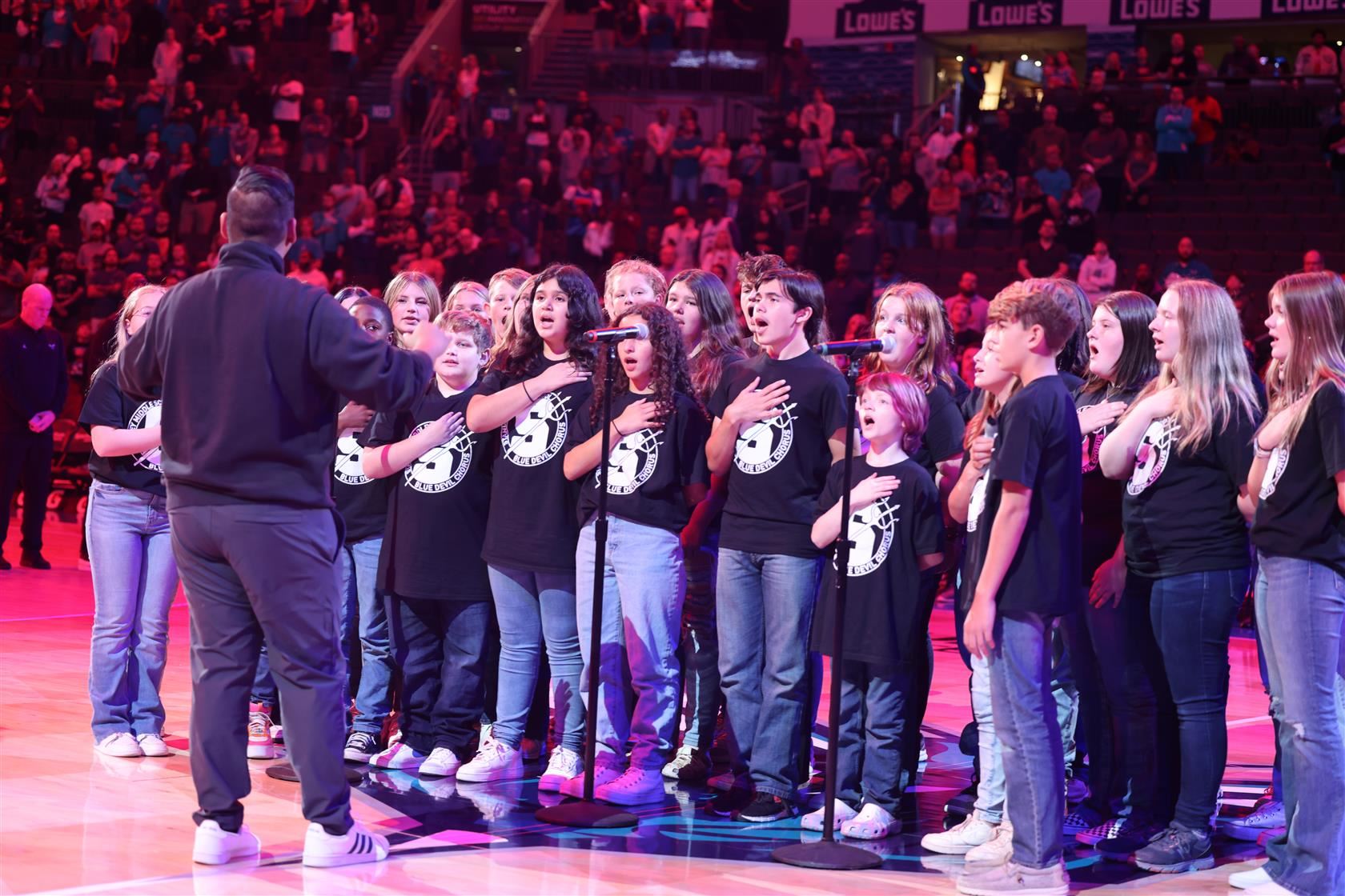 Nyi Nyi Myin conducts his middle school chorus group