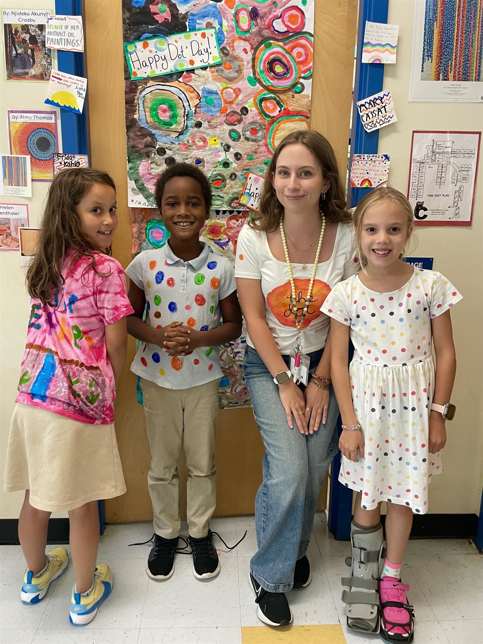 Katherine McDonald and three students wearing dots for Dot Day
