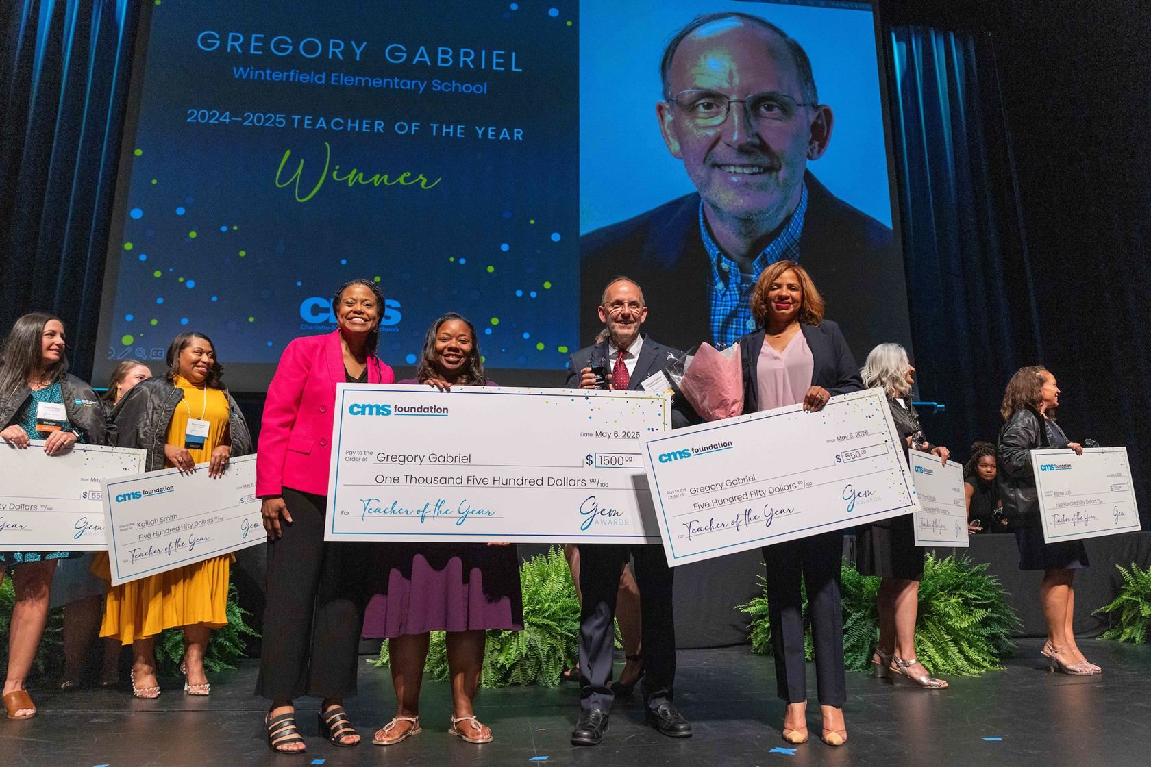 Gregory Gabriel smiles as he's announced the CMS 2024-25 Teacher of the Year