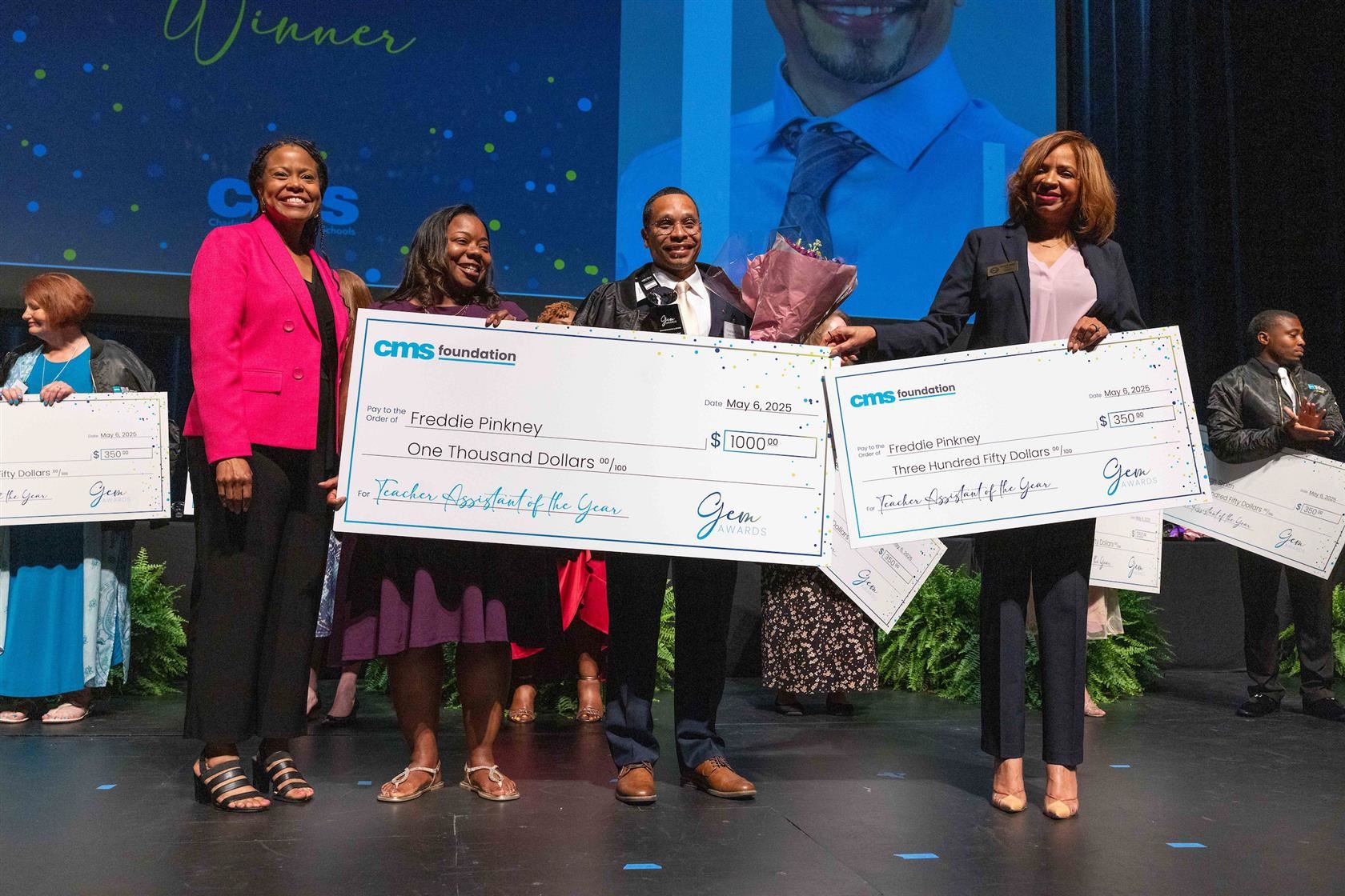 Freddie Pinkney smiles as he's announced as the CMS 2024-25 Teacher Assistant of the Year