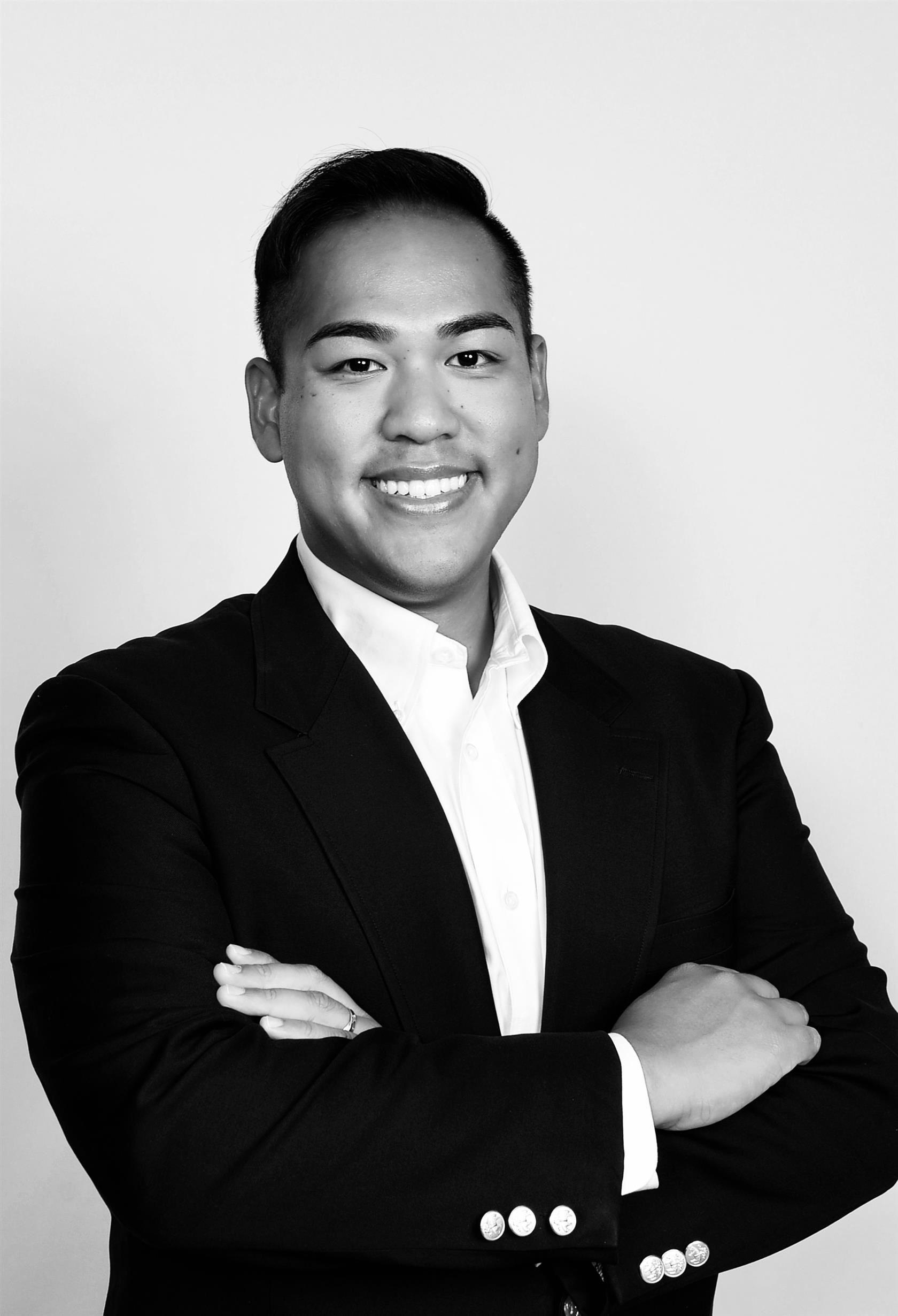 A black and white headshot of Nyi NYi Myin