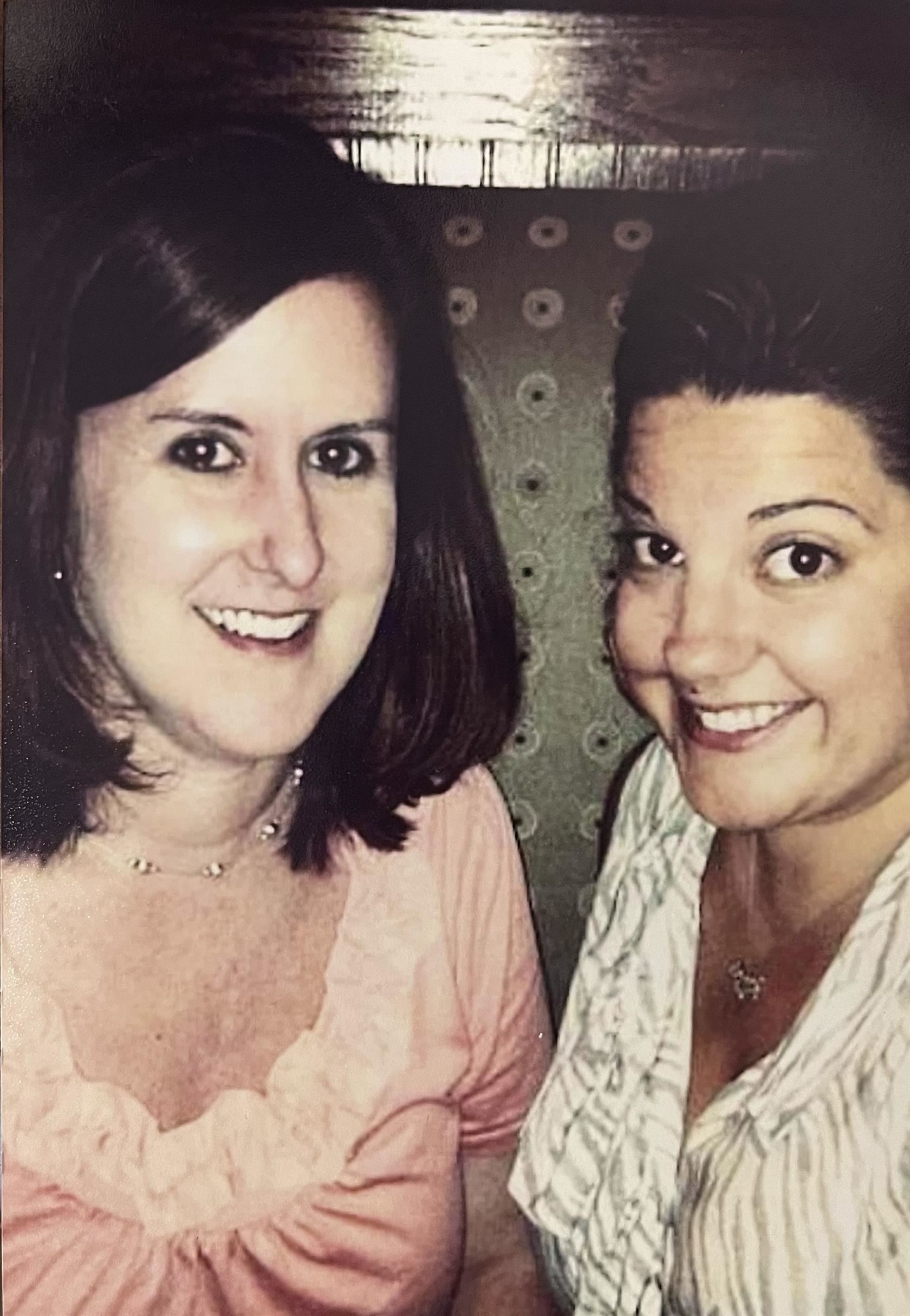 Avery Mitchell (left) and Brooklyn Hough (right) sit together in a booth. Mitchell was Hough's former middle school teacher.
