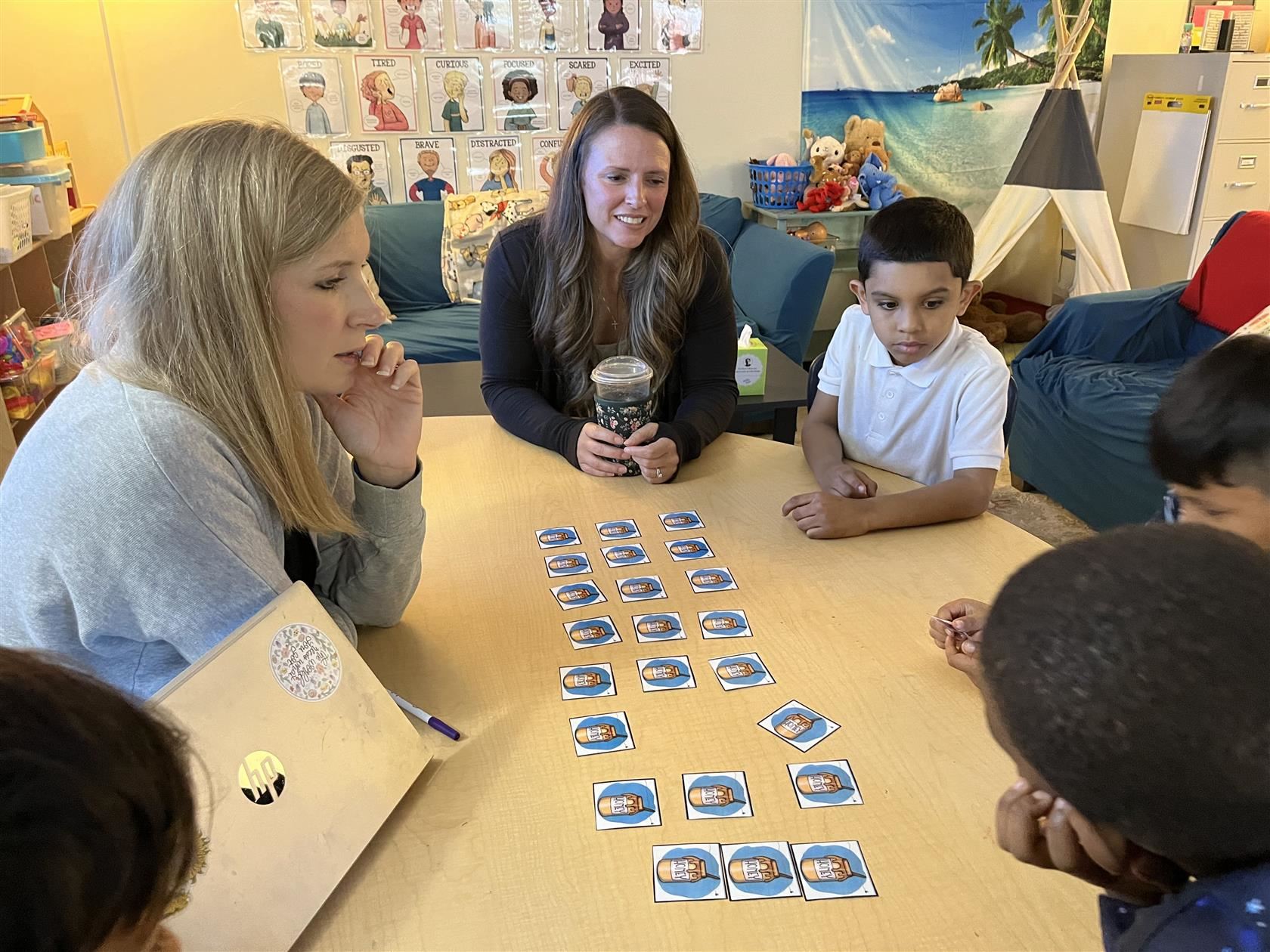 School Psychologist Corrie Gifford and Counselor Lindsay Natoli lead a small group.