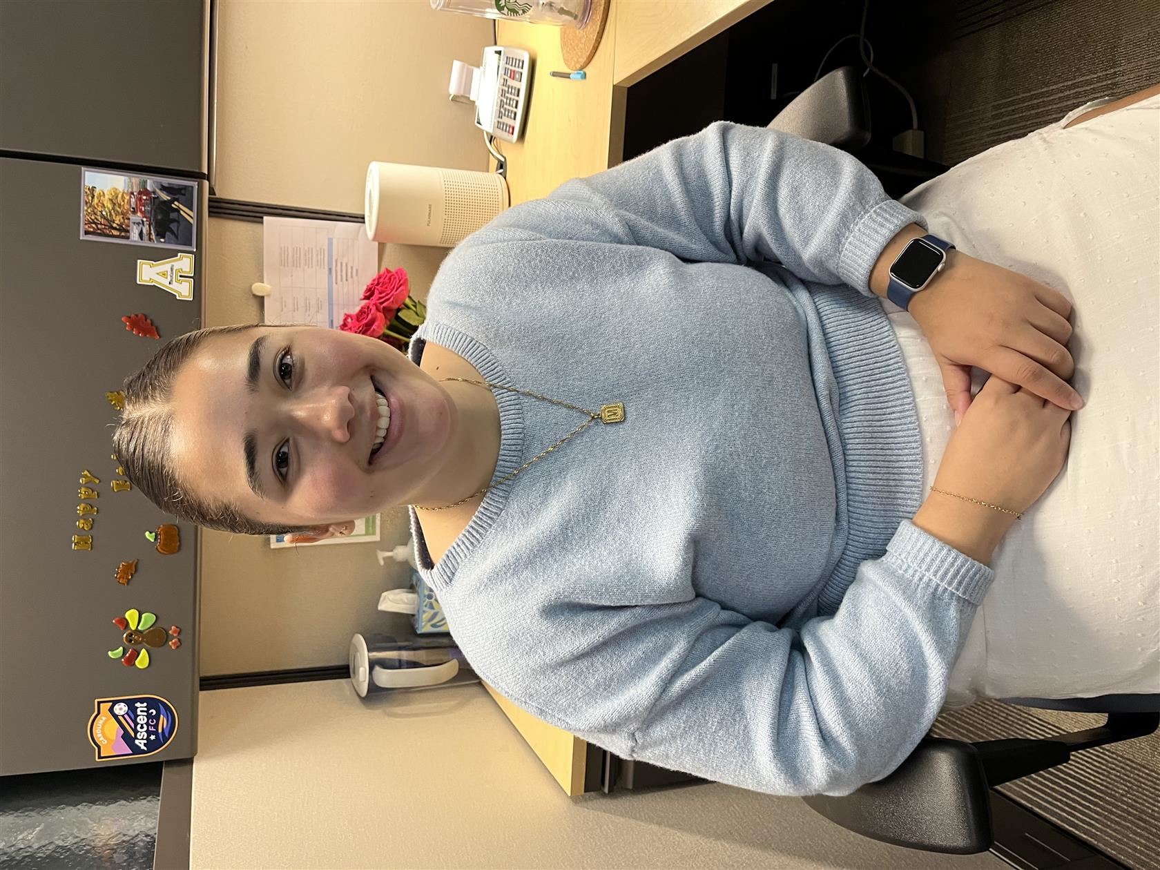 Melissa Castaneda sitting at her desk.