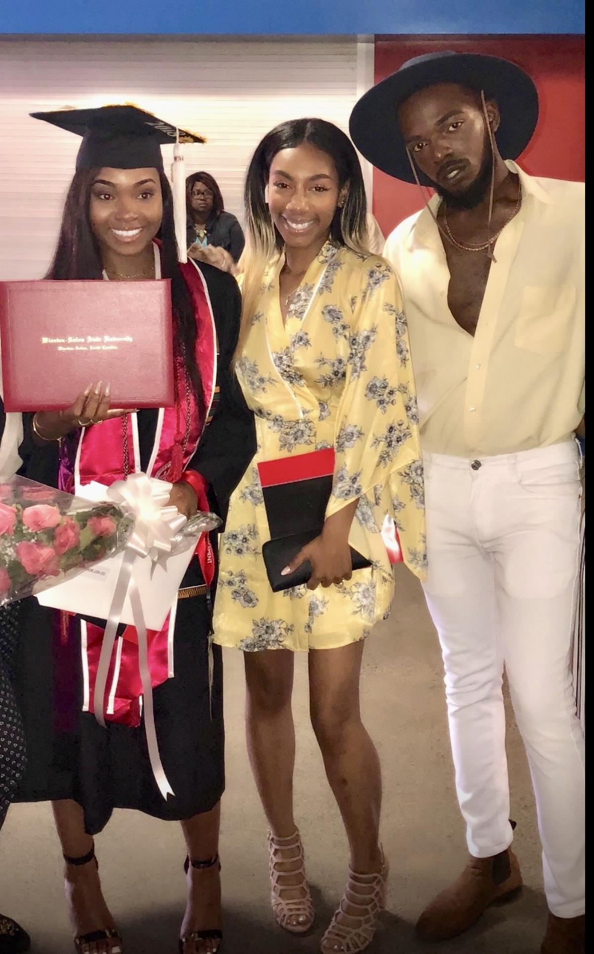 Malaysha Belton, left, smiles with her degree from Winston-Salem State University