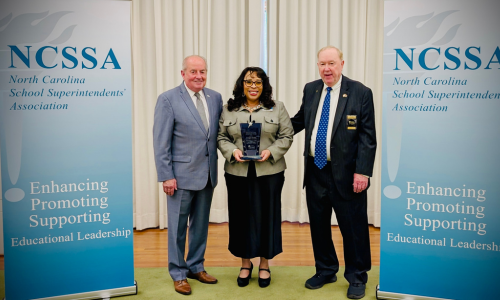  Dr. Ingrid Medlock (center) receives the Dr. Samuel Houston Leadership Award