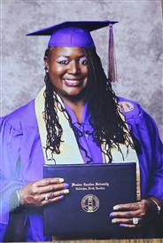 Paw Creek ES's Rachelle Gethers with diploma