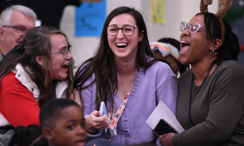  Smith smiling with her coworkers.