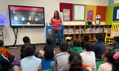  Rene Kimray stands before students at Albemarle Road Elementary School