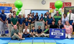  Students and ACC representatives pose in a classroom