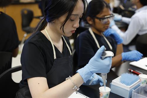 Student using syringe