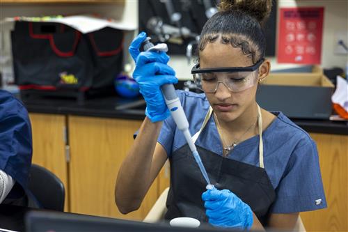 Student 2 using syringe